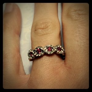Beautiful  sliver ring with pink gemstones.